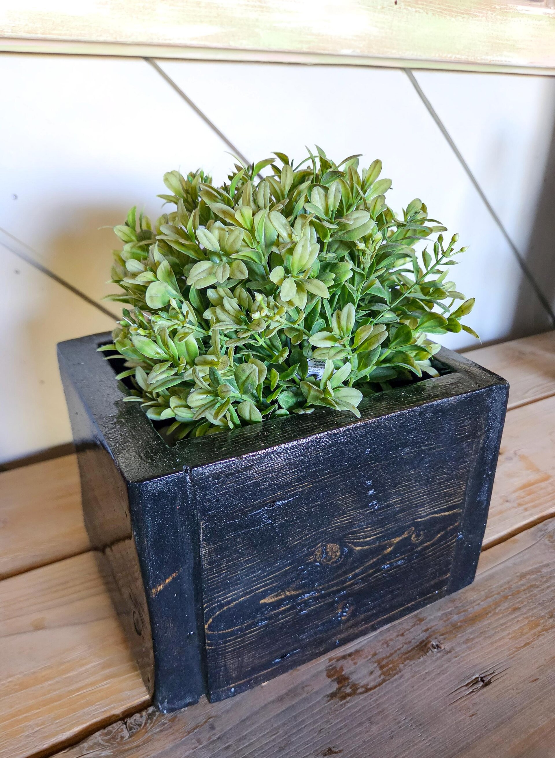 Handmade rustic wooden organizer caddy crafted from reclaimed wood, styled with greenery for farmhouse bathroom countertop storage.